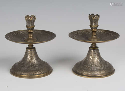 A pair of late 19th century gilt and silvered brass candlest...