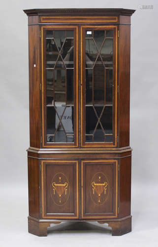 A 20th century George III style mahogany corner display cabi...