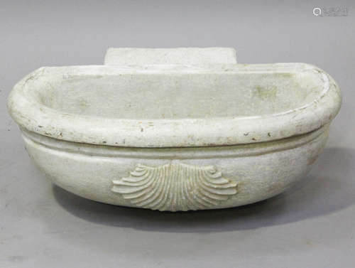 A 19th century carved white marble holy water stoup, the fro...