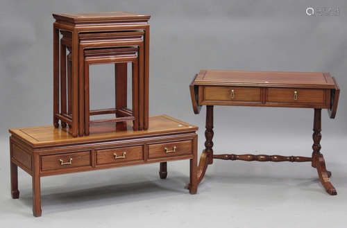 A modern Chinese hardwood nest of three occasional tables, h...