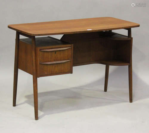 A mid-20th century Danish teak desk of retro design, designe...