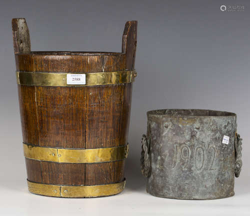 An early 20th century brass bound coopered oak bucket, heigh...