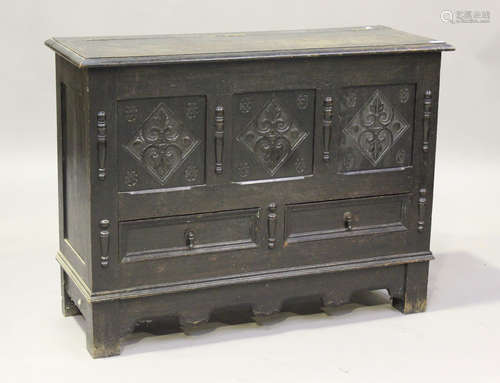 A 20th century oak mule chest with hinged lid, on block legs...