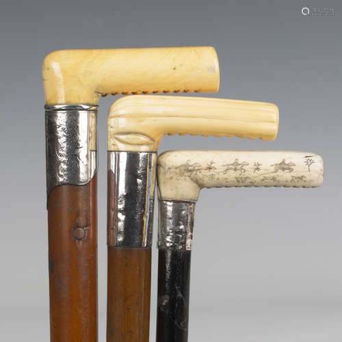 A 19th century Malacca walking cane with ivory handle and en...