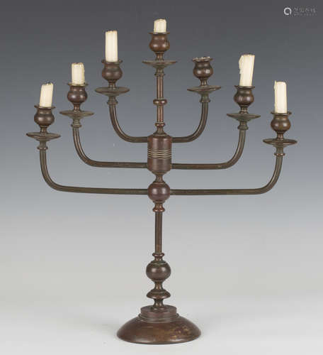 A 20th century brown patinated bronze seven-light menorah, h...