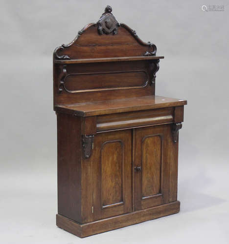 A small Victorian mahogany chiffonier with carved foliate cr...