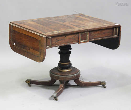 A Regency rosewood and brass inlaid sofa table, in the manne...