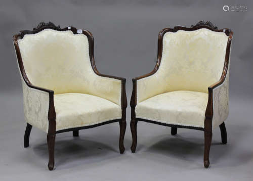 A pair of George V stained beech salon armchairs, upholstere...