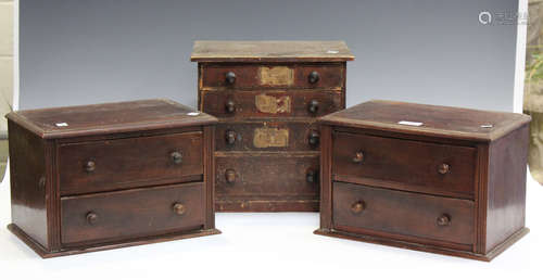 A Victorian stained pine table-top collector's chest of four...