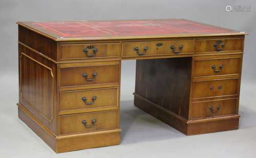 A 20th century reproduction yew twin-pedestal desk, height 6...