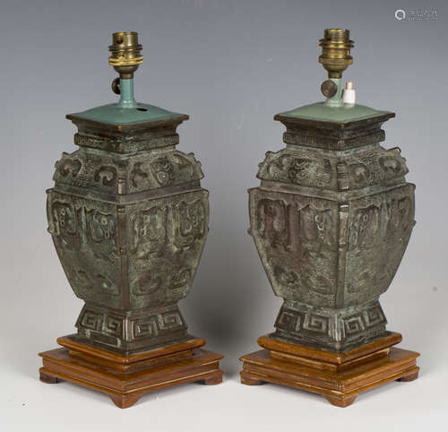 A pair of 19th century Chinese archaistic green patinated ca...