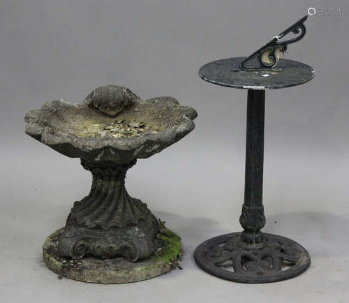 A 20th century cast composition stone garden bird bath of sc...