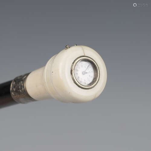 A late 19th century ebonized walking cane, the ivory screw-o...