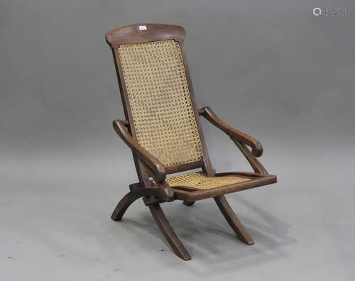 A late 19th century teak framed folding steamer armchair wit...