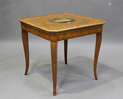 A late 20th century Italianate games table, profusely inlaid...