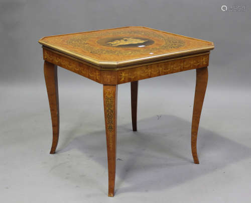 A late 20th century Italianate games table, profusely inlaid...
