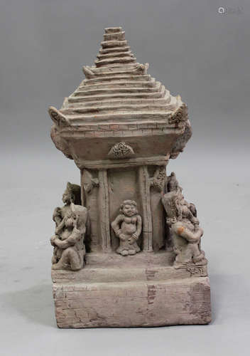 A Javanese terracotta model of a temple, each corner modelle...