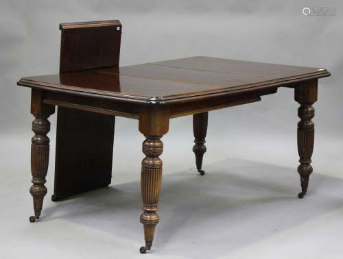 A 20th century Victorian style mahogany extending dining tab...