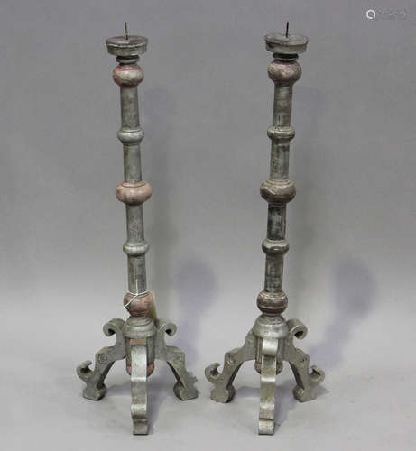 A pair of Portuguese silvered and pink painted wooden pricke...