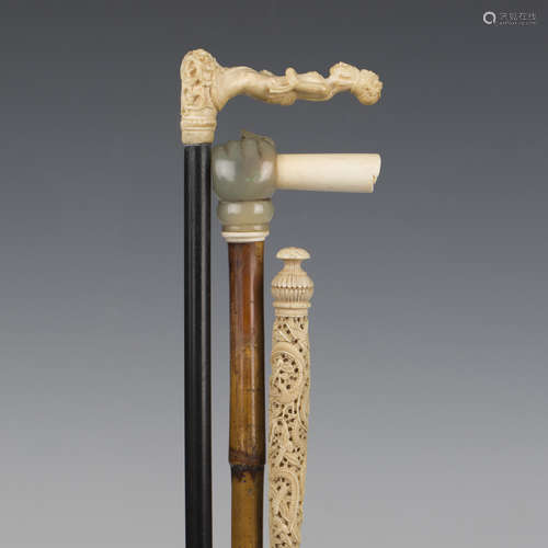 A 19th century ebonized walking cane, the Chinese carved ivo...