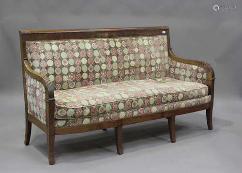 A late 19th century French mahogany showframe settee, uphols...