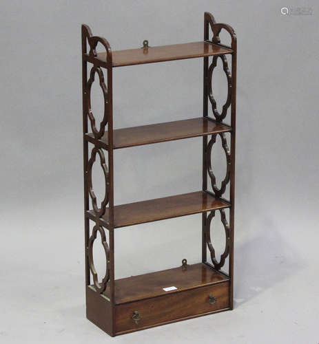 A 20th century reproduction mahogany hanging wall shelf, fit...