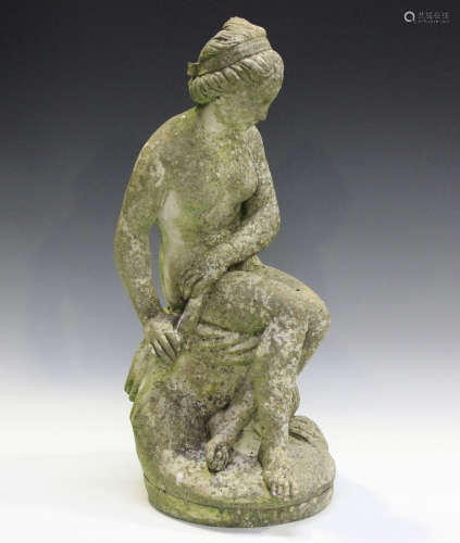 A late 20th century cast composition stone garden figure of ...