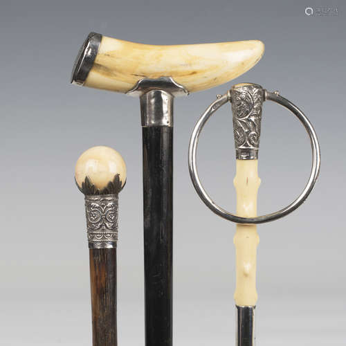 A late 19th century ebonized walking cane, the boar's tusk h...