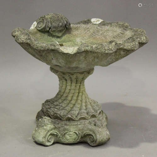 A late 20th century cast composition stone bird bath of scal...