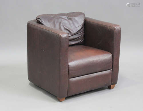 A modern Marks & Spencer brown leather tub back armchair, he...