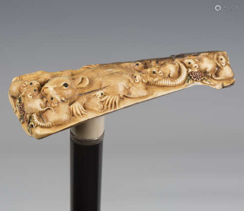 A late Victorian ebonized walking cane, the Japanese ivory h...