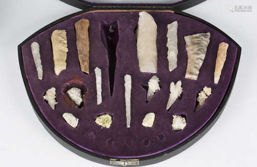 A cased display of early 20th century stalactite fragments a...