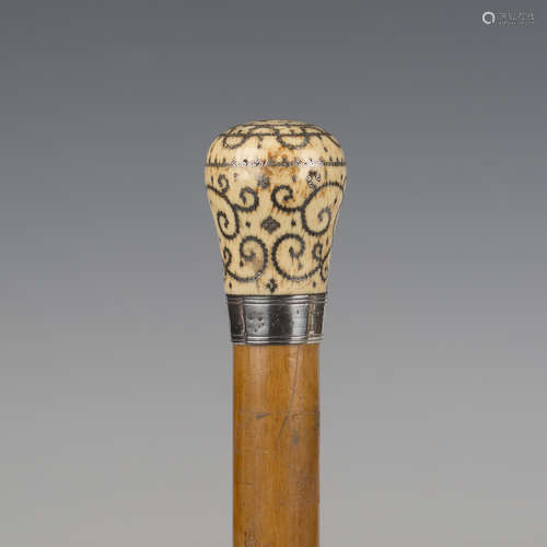 A late 17th/early 18th century Malacca walking cane, the ivo...