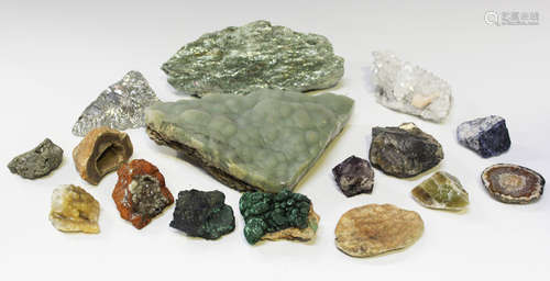 A collection of mineral specimens, including pyrites, variou...