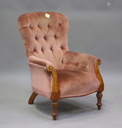 A late Victorian walnut framed armchair, upholstered in pink...