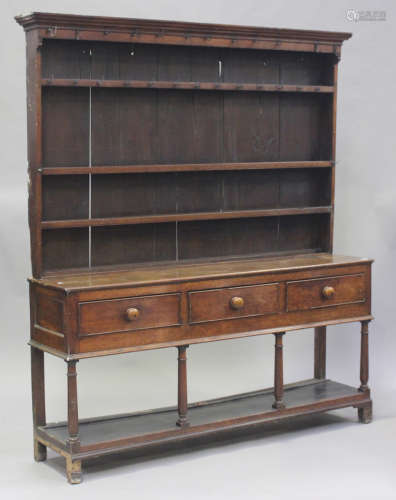 An early Victorian provincial oak dresser, the shelf back ab...