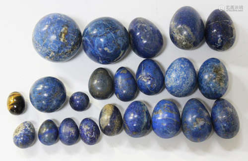 A group of polished lapis lazuli egg and sphere shaped speci...