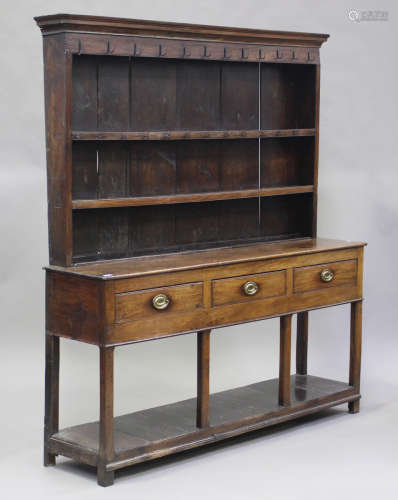 A George III oak dresser, the shelf back above three drawers...