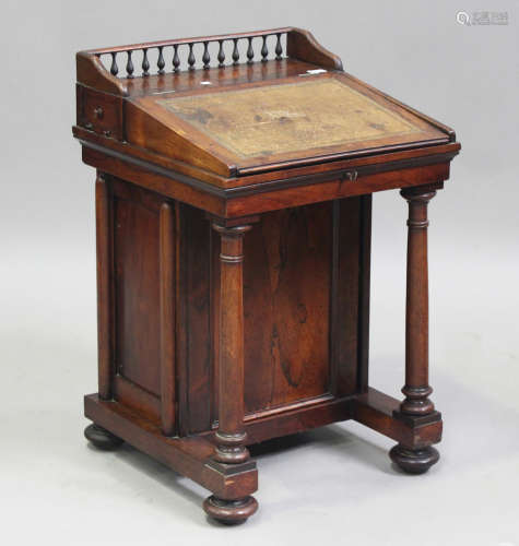 A George IV rosewood Davenport desk, the hinged writing surf...