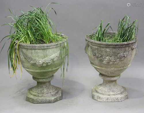 A pair of late 20th century cast composition stone garden ur...