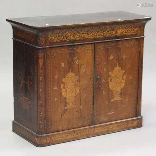 A late 19th century Dutch marquetry cabinet, profusely inlai...