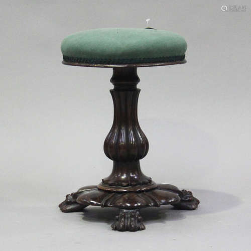 A Victorian rosewood revolving piano stool, the reeded balus...