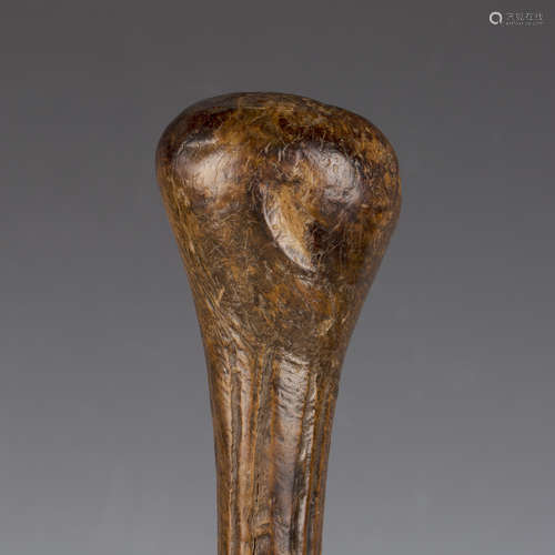 An ethnic club with bulbous end and fluted shaft, length 52c...