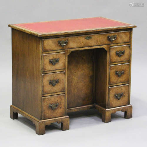 An early 20th century George I style walnut kneehole desk wi...