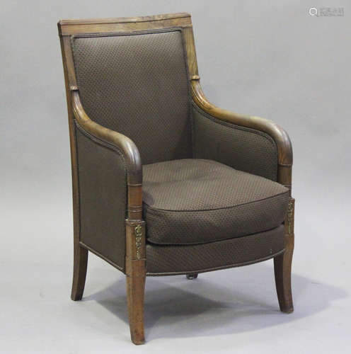 An early 19th century French Empire mahogany framed armchair...