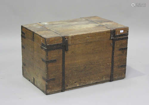 A late 19th/early 20th century pine and iron bound trunk, he...