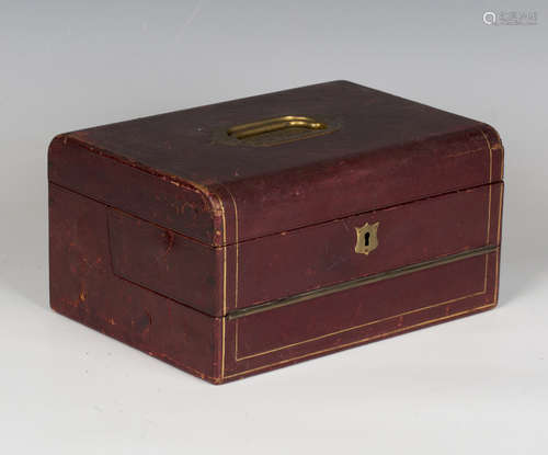 A Victorian claret leather and brass mounted travelling vani...