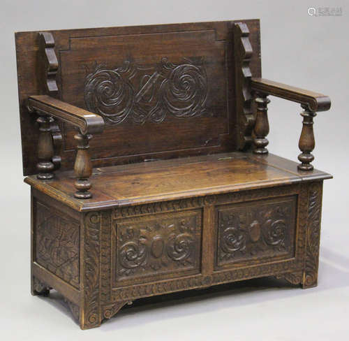 A George V oak monk's bench with carved decoration, height 7...