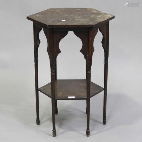 An early 20th century Arts and Crafts oak hexagonal two-tier...