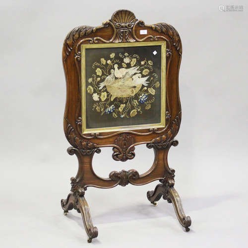 An early 19th century rosewood framed firescreen with carved...